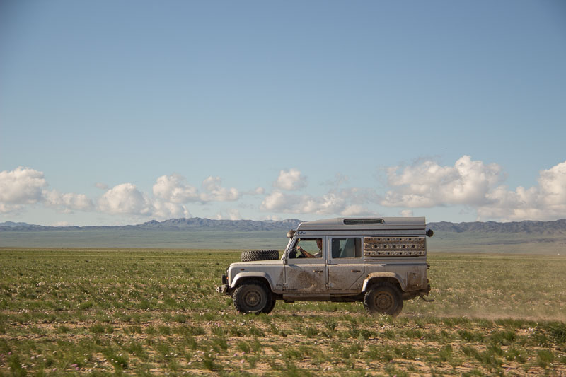 defender in the gobi gobi desert with landrover